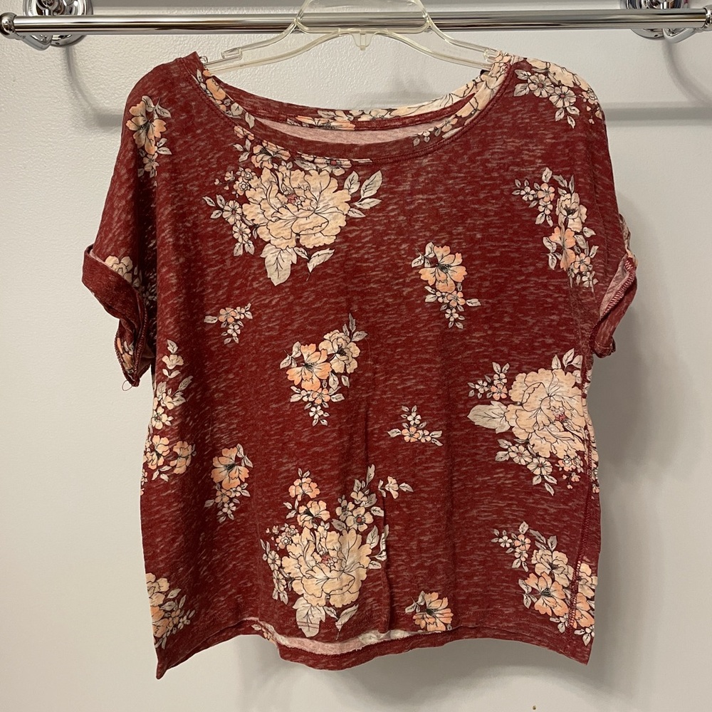 Very thin top. Falls at waist line, so slightly cropped